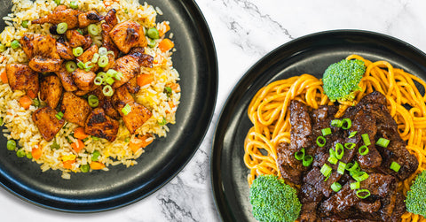 A close-up of a dish with glazed beef topped with chopped green onions, served alongside yellow noodles and a piece of broccoli.