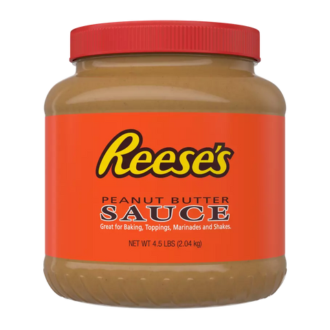 A 4.5-pound jar of peanut butter sauce- for shakes, featuring an orange label and red lid, labeled: “Great for Baking, Toppings, Marinades and Shakes.”.