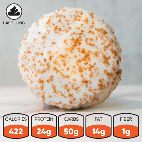 The VIP Buffin Muffin - Cookie Butter Tres Leches is a round, white-frosted dessert with brown sprinkles and a filling. Made with whey protein, it has 422 calories, 24g protein, 50g carbs, 14g fat, and 1g fiber.
