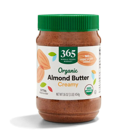 A 16-ounce jar of Almond butter- for shakes with a green lid and a label featuring almonds, product info, and "No sugar or salt added" on the front.
