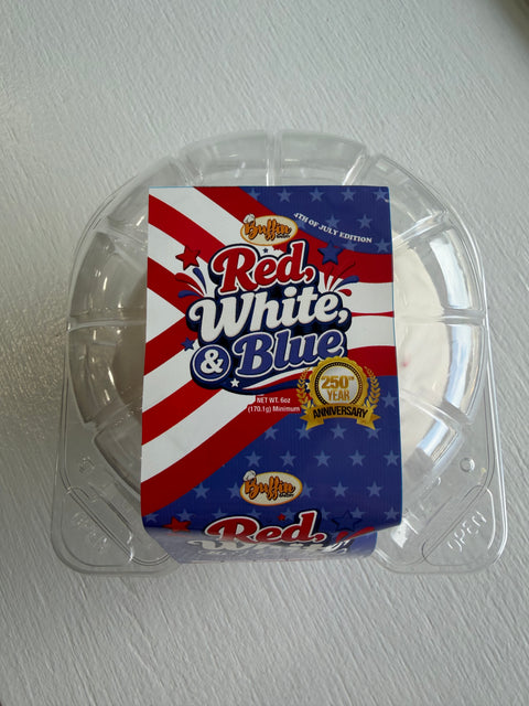 A plastic container holds a Red White Blue Buffin - Exclusive- 20 dessert with a red, white, and blue striped and starred label that reads “Red White Blue” and features Buffin Bakery’s 250th Year Anniversary badge for early-access products.