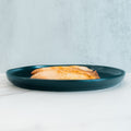Baked Herbed Tilapia 1lb Competition Approved is served on a dark teal plate, set against a light background—perfect for meal prep and supporting weight loss goals.