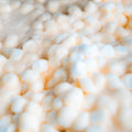 Close-up of small white marshmallows mixed in a creamy sauce, creating a soft, textured surface—perfect inspiration for Buff Cereal Bar Original Recipe, a delicious high protein snack or low sugar bar treat.