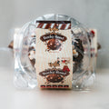Clear plastic container holds VIP Buffin - Rocky Road, featuring an image of chocolate-covered treats. Label highlights macro-friendly snack flavor, net weight 8oz, allergen info, and quality certification.