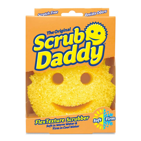 A yellow, round Scrub Daddy Sponges-Cleaning product with a smiling face and eye/mouth cutouts comes in an orange box, featuring flexible texture and safe, scratch-free cleaning.