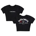 The American Baddie Baby Tee is a black crop top with the Baffin Bakery logo on the front and Baffin Bakery American Baddie MADE IN NY plus three colorful muffins on the back—a must-have NY streetwear cupcake shirt.