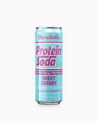 A can of BAREBELLS PROTEIN SODA in Sweet Cherry flavor, with a light blue background and pink/white text. It highlights caffeine, protein, and is non-artificial, unsweetened, and sugar-free.
