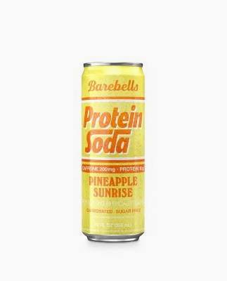 A yellow can of BAREBELLS PROTEIN SODA in Pineapple Sunrise flavor features bold orange and white text, highlighting its caffeine, protein content, carbonation, and sugar-free formula.