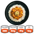 A serving of BBQ Meltdown—featuring white rice, BBQ chicken, cheddar cheese, and a relish topping on a black plate—creates the perfect high-protein meal prep with 588 calories, 50g protein, 61g carbs, and 16g fat.