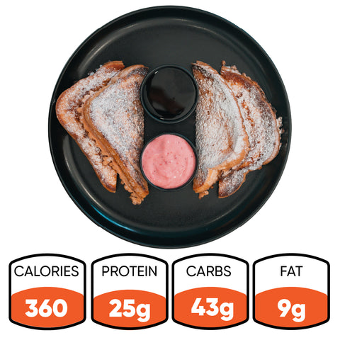 A black plate holds four powdered sugar-dusted Blueberry French Toast halves with two dipping sauces, plus nutrition info: 360 calories, 25g protein, 43g carbs, and 9g fat—a delicious high-protein breakfast.