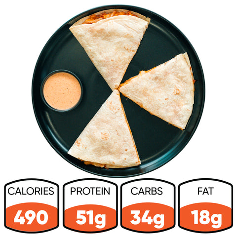 A black plate holds three Buffalo Chicken Quesadilla slices with dipping sauce. Each high-protein meal has 490 calories, 51g protein, 34g carbs, and 18g fat—ideal for meal prep or a quick bite.