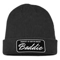 The Buffin Bakery “Baddie” Script Beanie black patch is a black rib-knit cuffed beanie with a folded brim and a rectangular patch—ideal for athleisure outfits or staying warm during cold-weather workouts.