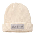 The Buffin Baddie Club Grey Cuffed Patch Beanie is a unisex ribbed knit beanie with a folded brim and a front patch that reads Buffin Baddie Club in cursive—ideal as your go-to gym beanie.