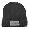 The Buffin Baddie Club Grey Cuffed Patch Beanie features a ribbed knit design, folded brim, and a gray patch with “Buffin Baddie Club” in cursive—perfect for adding style to your gym outfit or everyday workout look.