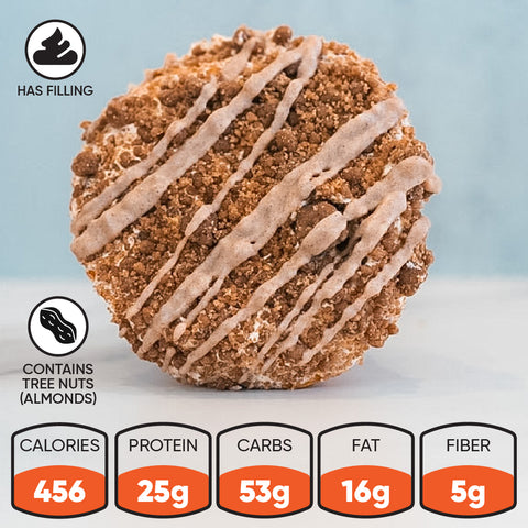 Introducing the Basic Baddie Buffin Muffin: a round pastry crowned with crumbly streusel and drizzled with white icing. This pumpkin spice protein muffin serves as a high-protein snack, featuring 456 calories, 25g of protein, 53g of carbs, 16g of fat, and 5g of fiber per serving. With a delicious filling and almonds included, it’s a tasty dessert option that’s also low in caffeine.