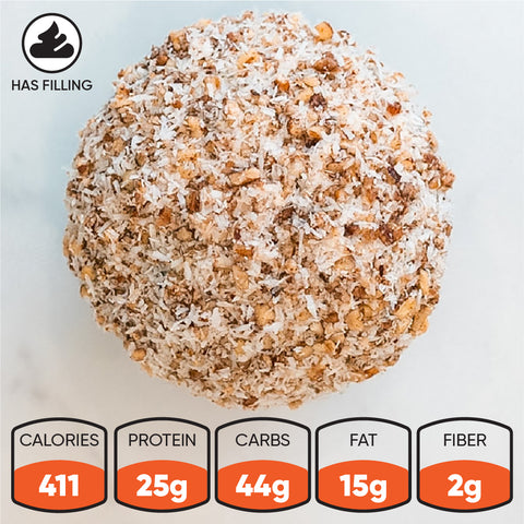 Buffin Muffin - German Chocolate Cake: A round, protein-packed snack inspired by German Chocolate Cake, coated in nuts and coconut. 411 cal, 25g protein, 44g carbs, 15g fat, 2g fiber. “Has filling” label in the top left corner.
