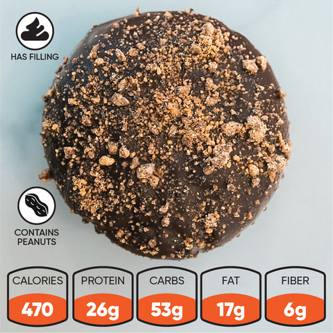 PB Blackout Exclusive chocolate-covered donut topped with cookie crumbles, featuring peanut and filling icons, and a nutrition label listing 470 calories, 26g protein, 53g carbs, 17g fat, and 6g fiber.