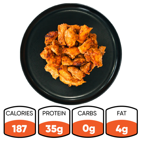 A black plate with cooked Competition Approved Chicken Kebab 1lb pieces—ideal for meal prep. Beneath, icons show: 187 calories, 35g protein, 0g carbs, and 4g fat.