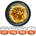 Chicken Stir Fry: Gochujang teriyaki chicken on fried rice with veggies, topped with green onions. High-protein meal—477 calories, 44g protein, 55g carbs, and 9g fat. Perfect for a quick, healthy dinner.