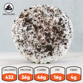 Introducing Cookies and Cream Crunch—a round black cocoa cake dessert with a creamy filling, topped with white icing and crunchy cookie crumbles. Packed with 432 calories, 26g of protein, 46g of carbs, 16g of fat, and 4g of fiber, this high-protein treat is perfect for cookies cream lovers. The “has filling” label appears in the top left corner for easy identification.