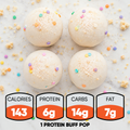 Four round, sprinkle-topped Protein Buff Pops - Dunk’d Out rest on a white surface—each delicious vanilla cake popper is a satisfying low-calorie protein snack with 143 calories, 6g protein, 14g carbs, and 7g fat per pop.