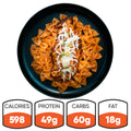 Farfalle Chicken Alfredo: High-protein pasta in creamy sauce with grilled chicken, melted cheese, and green onions. Ready-to-heat meal with 598 calories, 49g protein, 60g carbs, and 18g fat.