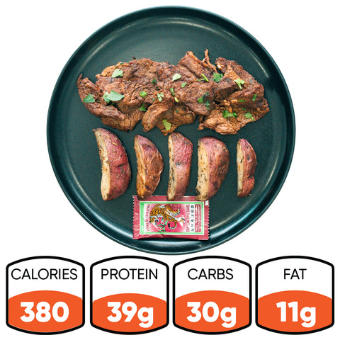 The Garlic Flank Bowl features grilled garlic flank steak, roasted potatoes, and a sauce packet. It provides 380 calories, 39g protein, 30g carbs, and 11g fat—a flavorful high-protein meal.