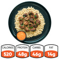 The “GLORIOUS GAINS” Steak Bites Cilantro Lime Rice features tender beef over cilantro lime rice with green garnish and an orange dipping sauce. Each bowl has 520 calories, 48g protein, 46g carbs, and 14g fat—ideal for high-protein meal prep.