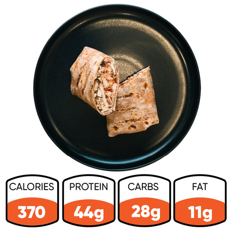 A black plate displays a Grilled Chicken Parmesan Wrap, halved to show its filling and wrapped in a whole wheat tortilla. Nutrition info below: 370 calories, 44g protein, 28g carbs, and 11g fat—making the Grilled Chicken Parmesan Wrap ideal for healthy meal prep.