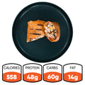 The Hey Arnold Burrito, shown halved on a black plate, is perfect for meal prep: 558 calories, 48g protein, 60g carbs, and 14g fat. Inspired by a high-protein chicken burrito.