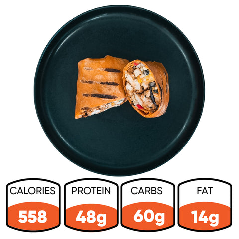 The Hey Arnold Burrito, shown halved on a black plate, is perfect for meal prep: 558 calories, 48g protein, 60g carbs, and 14g fat. Inspired by a high-protein chicken burrito.
