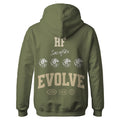 The Hummus Fit Varsity EVOLVE Hoodie Olive is a mid-weight fleece featuring “HF,” “Sacrifice,” three lion heads, bold “EVOLVE” text on the back, and multiple small logos and badges near the hem.