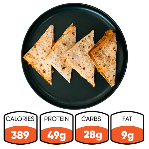 Four quesadilla wedges on a black plate, shown from above—this HFit Signature Fold is perfect for healthy grilled chicken meal prep. Below are nutrition facts: 389 calories, 49g protein, 28g carbs, and 9g fat.