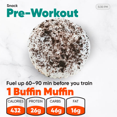 A muffin topped with white frosting and chocolate cookie crumbles displayed with nutritional information for the Women’s Fat Loss Fall Plan, including calories, protein, carbs, and fat.