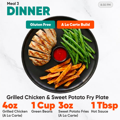 A meal from the Women’s Fat Loss Fall Plan featuring halal grilled chicken, green beans, and sweet potato fries with red sauce, accompanied by text detailing the meal components and dietary labels.