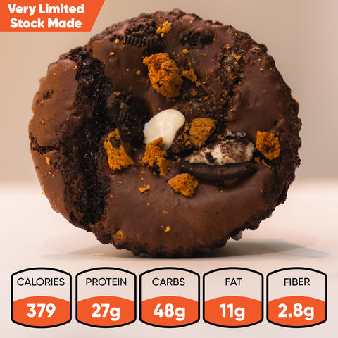 A close-up of the Buffin Muffin VIP - Darc Sport Double Cookie with cookie pieces and white chips, shown above its nutrition panel: 379 calories, 27g protein—perfect as a high-protein breakfast or post-workout snack. Very Limited Stock Made.