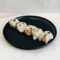 Keto Ricotta Meatballs served on a black plate with creamy white sauce and green herb garnish—an ideal low-carb, high-protein meal option.