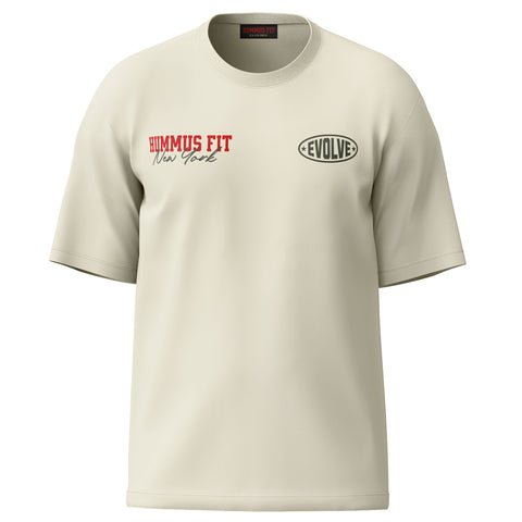 The New York Heritage Oversized Tee — Cream is a premium cotton short-sleeve, oversized fit with HUMMUS FIT New York in red and black on the left chest and a black oval EVOLVE logo on the right—ideal for NYC streetwear.