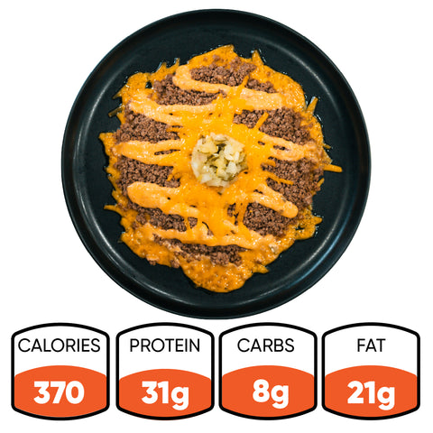The Low Carb Keto Cheeseburger Bowl features ground beef, melted cheddar, and diced onions for a tasty high-protein, low-carb meal. Nutrition: 370 calories, 31g protein, 8g carbs, 21g fat.
