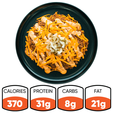 A black plate holds a Low Carb Keto Cheeseburger Bowl: ground meat, shredded cheddar, chopped onions, and creamy orange sauce. Nutrition facts show 370 calories, 31g protein, 8g carbs, and 21g fat for this high-protein, low-carb meal.