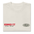 A folded off-white t-shirt with HUMMUS FIT New York in red and black text on the left chest and EVOLVE in an oval logo on the right chest.