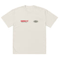 A plain off-white T-shirt featuring “HUMMUS FIT New York” in red and black text on the left chest, and an oval-shaped “EVOLVE” logo in black on the right chest.