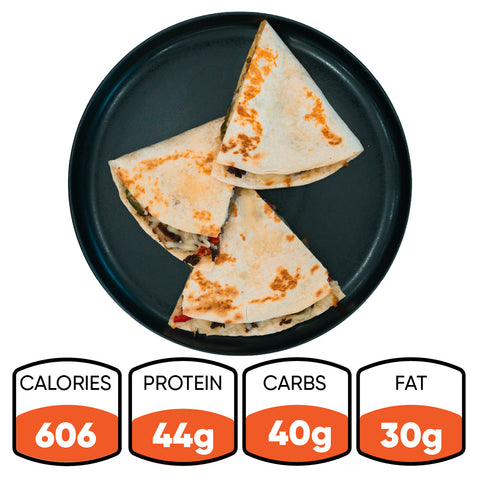 Enjoy three slices of the Philly Cheesesteak Quesadilla on a black plate—a macro-friendly option delivering 44g protein, 40g carbs, and 30g fat for only 606 calories. Ideal for high-protein meal prep or curbing your cheesesteak cravings. Full nutrition details below.