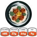 A black plate with rice, broccoli, and four Pineapple Teriyaki Meatballs topped with green onions. Nutrition: 485 calories, 37g protein, 64g carbs, 9g fat—Pineapple Teriyaki Meatballs are perfect for high-protein meal prep.