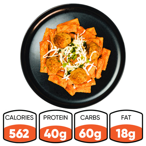 A black plate with Rigatoni Meatballs in red sauce, topped with shredded cheese, is viewed from above. Nutrition info below: 562 calories, 40g protein, 60g carbs, and 18g fat.