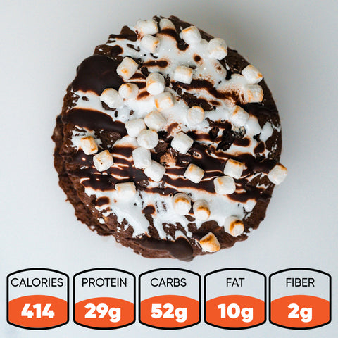 Rocky Road is a high-protein chocolate muffin dessert with mini marshmallows, chocolate and white icing. Nutrition: 414 calories, 29g protein, 52g carbs, 10g fat, and 2g fiber a macro-friendly snack.