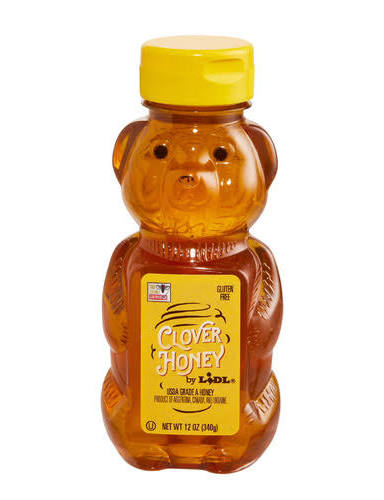 A plastic bear-shaped bottle with a yellow cap and label holds 12 oz 340g of Honey Syrup-For Shakes by LIDL.