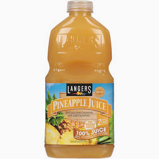 A plastic bottle of Pineapple Juice- For Shakes with yellow-orange juice inside. The label has a pineapple image, states 100 Juice and No Added Sugar. Comes with a screw cap.