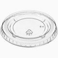 A clear, round plastic sauce cup lid with ridged edges and a recycling symbol in the center, shown on a white background. This 2500-count pack of sauce cup LIDS is perfect for keeping essentials in stock.