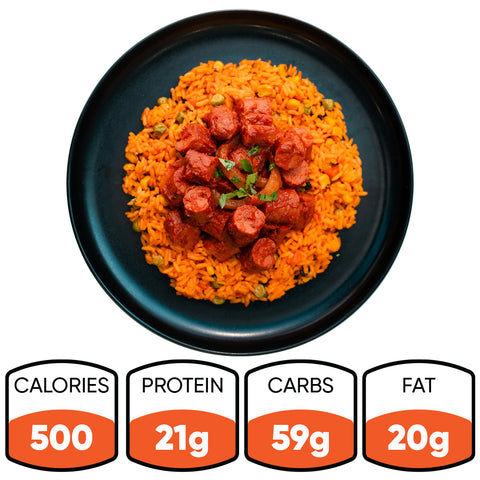 Smoky Beef Sausage and Rice features orange jasmine rice with smoky beef sausage in red sauce, finished with herbs. Nutrition: 500 calories, 21g protein, 59g carbs, 20g fat—a comforting meal option.